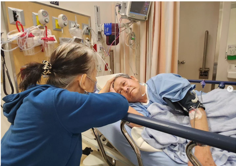 A man on a hospital bed