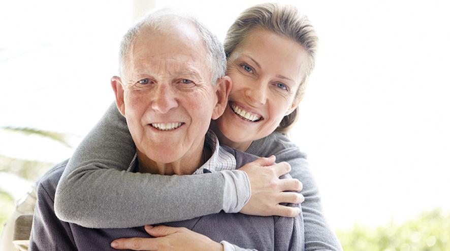 Father and daughter smiling