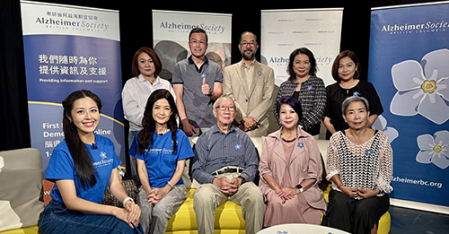 female host with telethon committee group photo