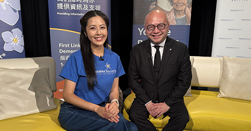 female host interviews a male doctor and posing for a photo for a telethon 