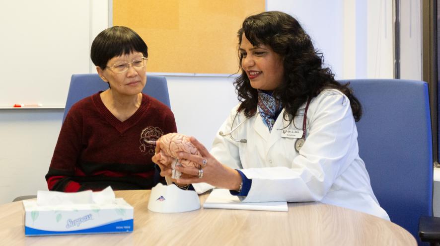 Chinese female chatting with the doctor