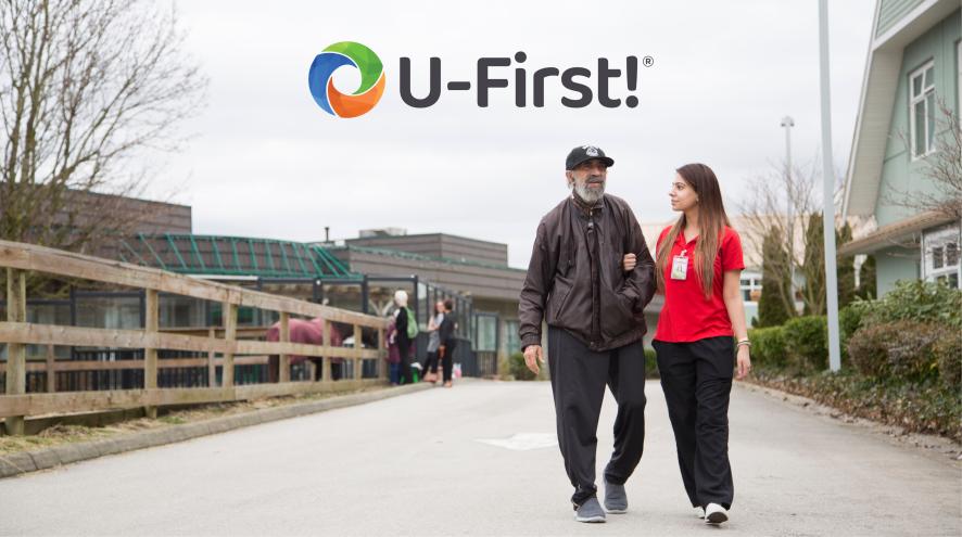 health care aide walking with resident