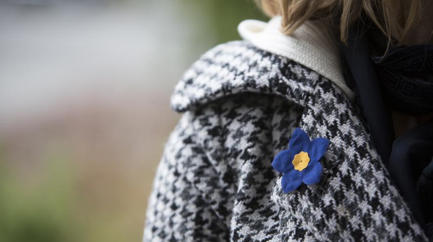 Photo of houndstooth jacket with forget me not brooch