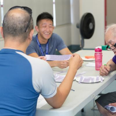 Volunteers socializing and smiling at a Minds in Motion session.