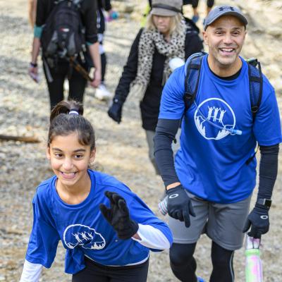 Talia smiling as she climbs Grouse Mountain in the 2019 Climb for Alzheimer's.