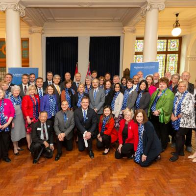 Society staff and volunteers pose for a group photo with members of B.C.'s Legislative Assembly.