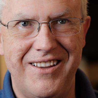 Jim Mann smiling broadly.