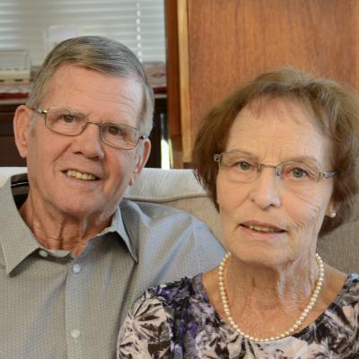 Klaus and Trudy sitting together on a sofa.