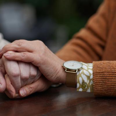 Two people holding hands