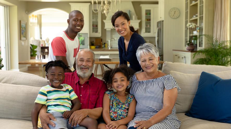 Family smiling and facing camera