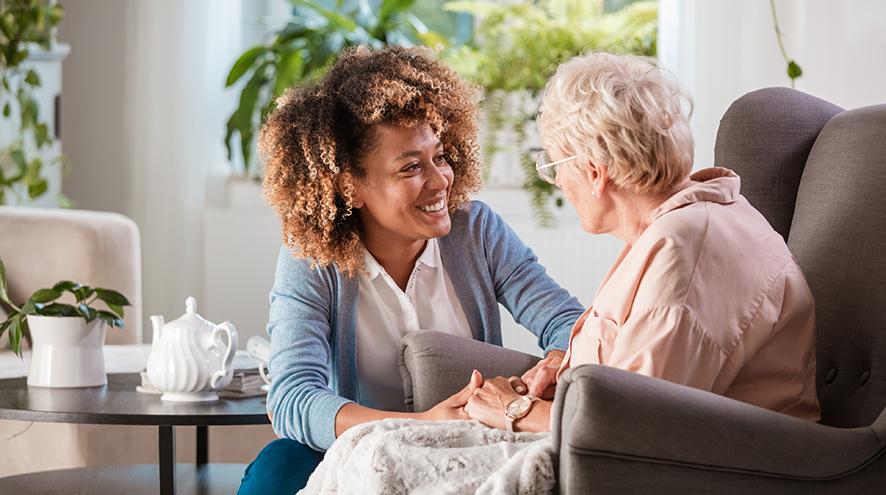 Young caregiver helping out a person living with dementia.