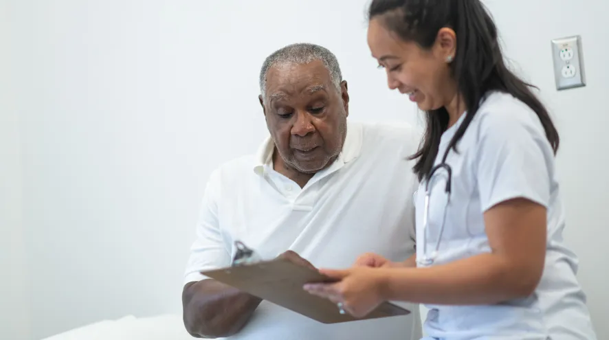 Doctor and patient going over form