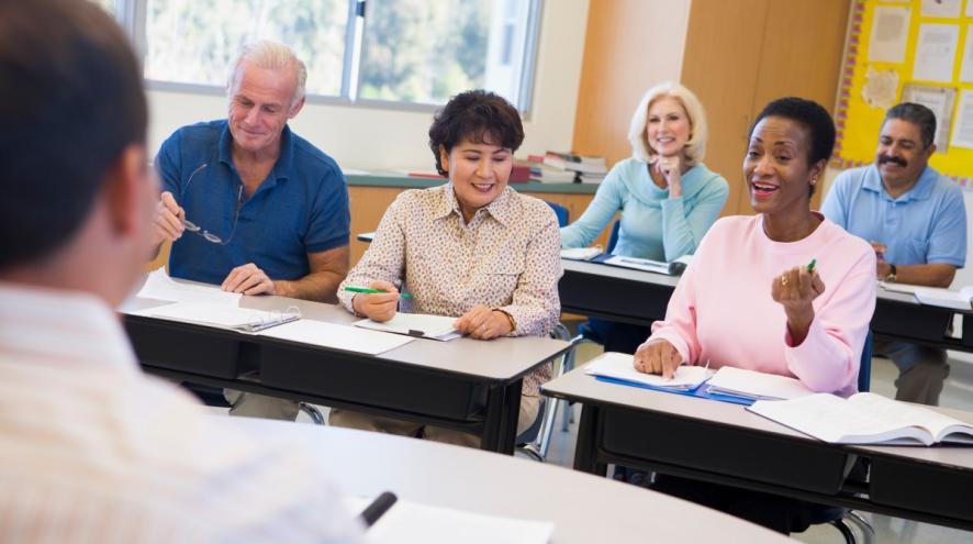 Mature students learning in a classroom.