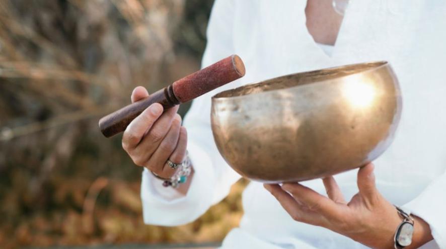 A close up of a singing bowl