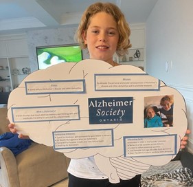Isaac holding his project.