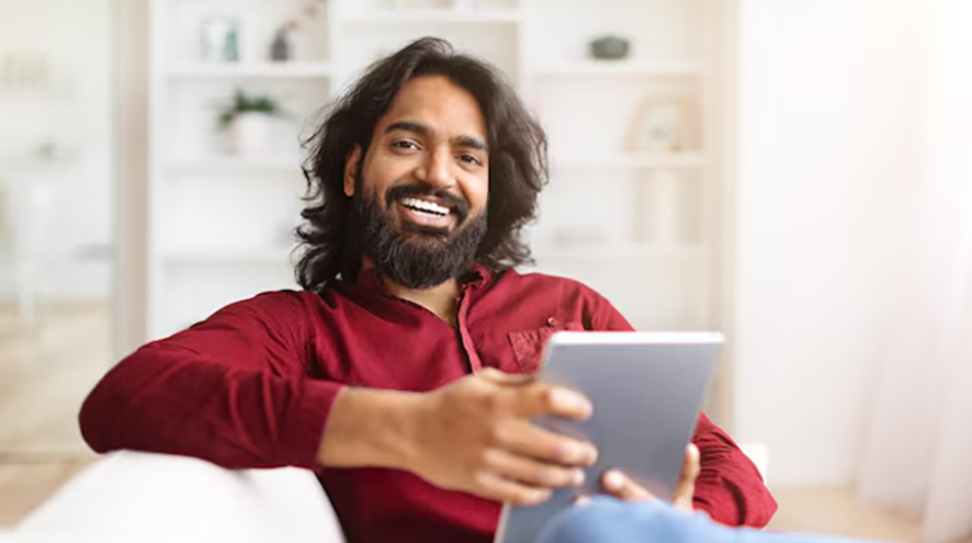 a man holding a tablet