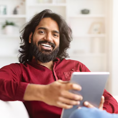 a man holding a tablet