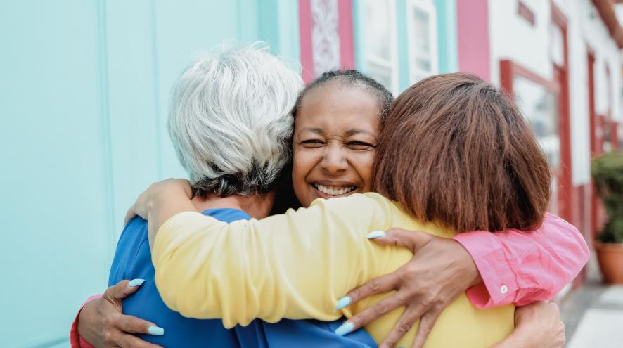 Group hug between three people.