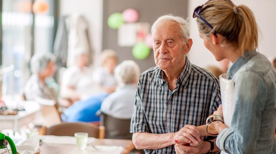 Senior man being helped at a local program.