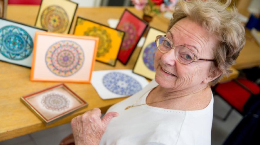 Senior woman at her art class.