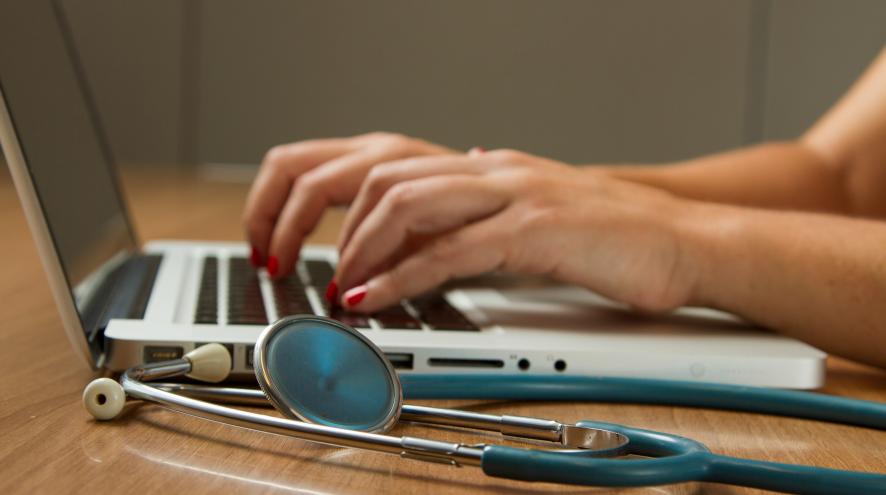 person typing on a laptop