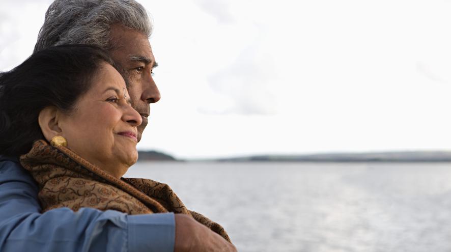 Couple standing by the sea 